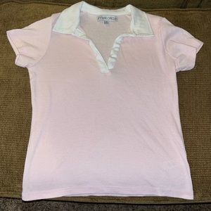 Pink tennis shirt with white collar.